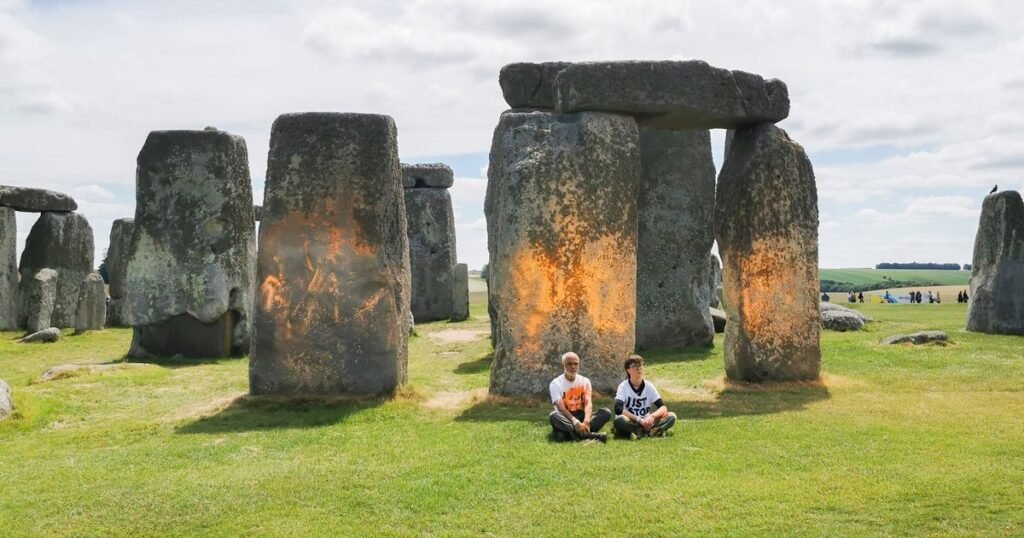 UK Climate Protesters Cover Stonehenge In Orange Paint Ahead Of Election